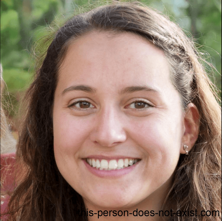 A smiling young woman with long brown hair and a braid looks directly at the camera.